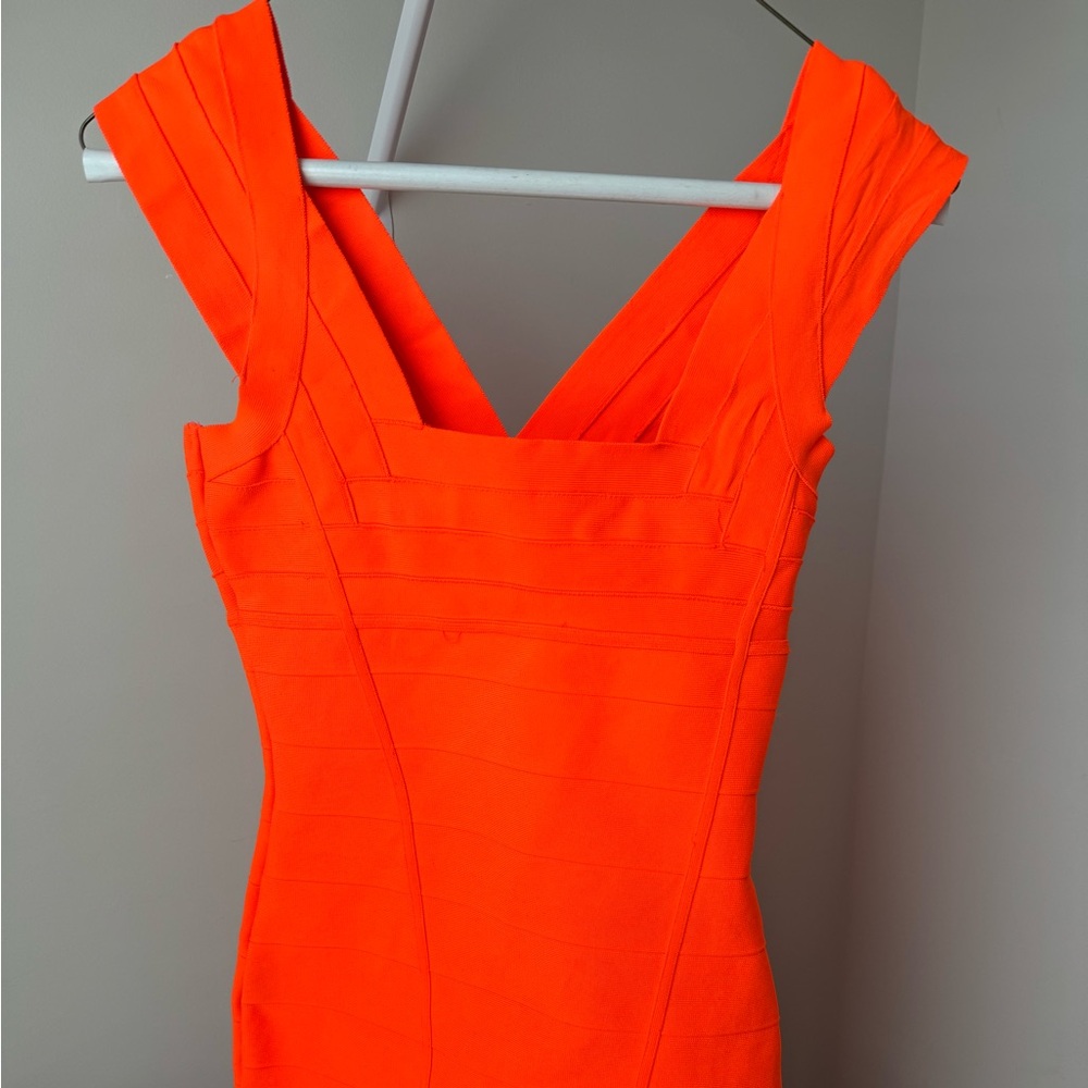 Bright neon orange bandage dress